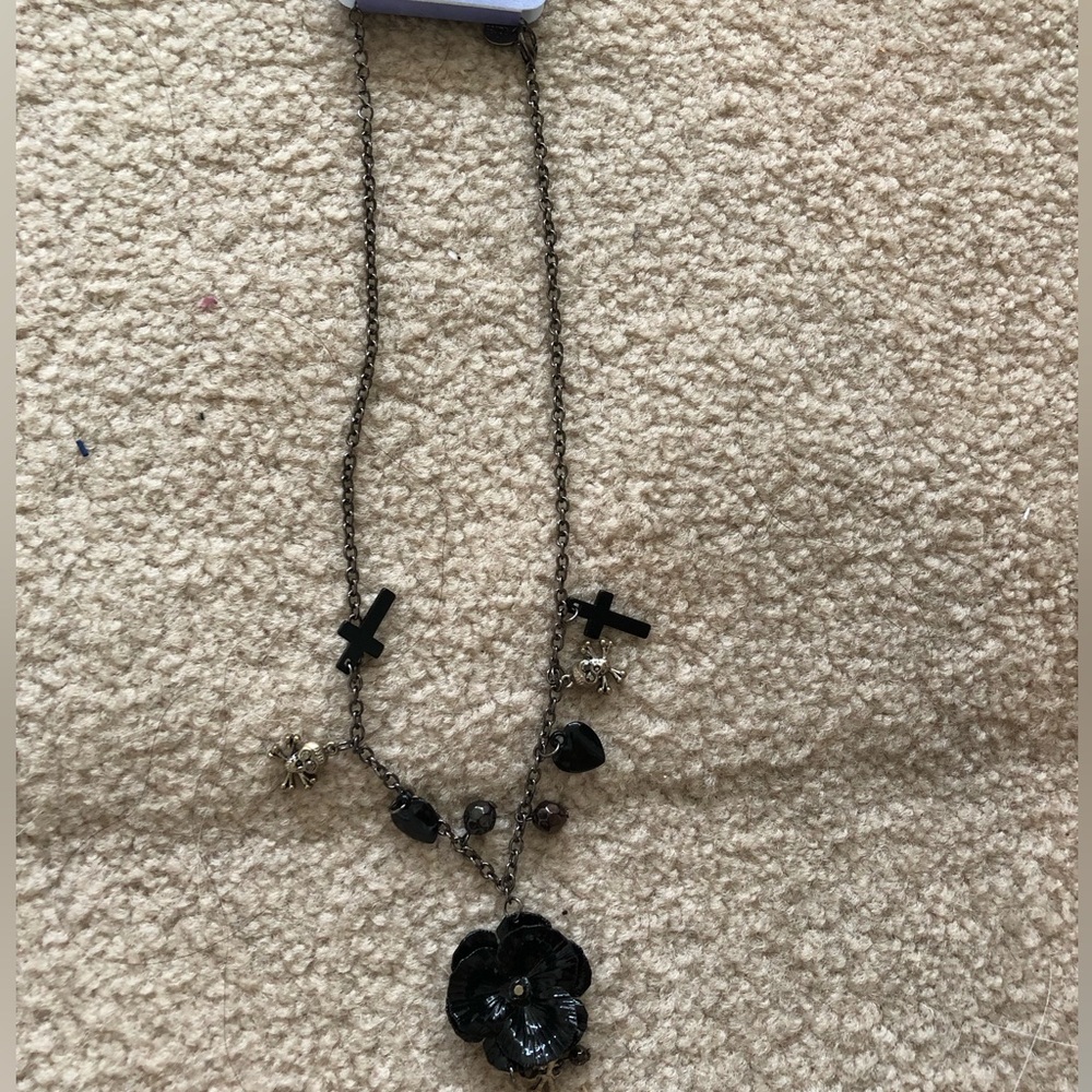 Claire’s Black Skull, Cross, & flora necklace
